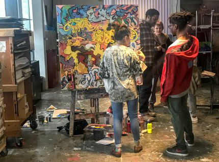 Teens painting.